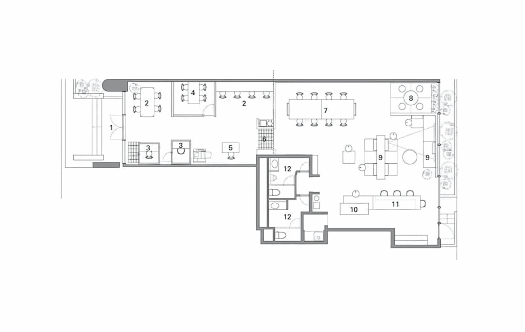 A compact coworking space plan with a mix of desks, small meeting areas, and a common lounge.